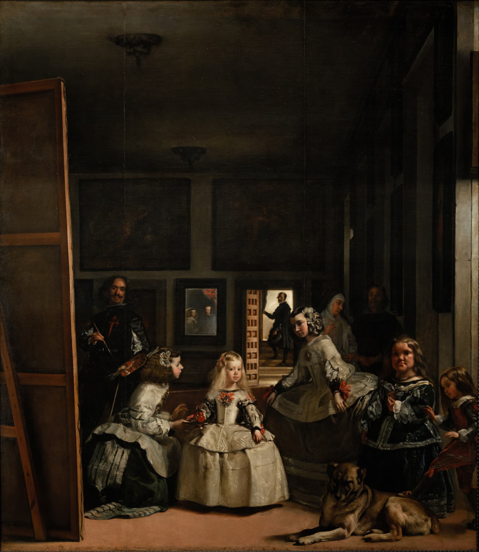 Las Meninas by Diego Velazquez: the infanta Margarita among her attendants, with the painter at his canvas, a dog, a mirror on the far wall, and a figure in the lit doorway